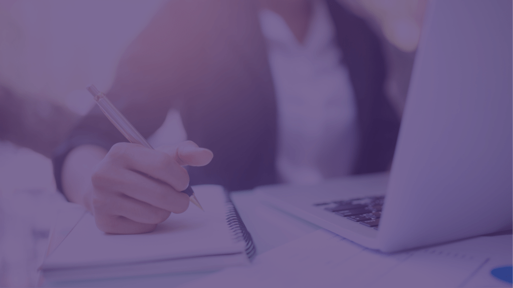 Woman working using notebook and laptop